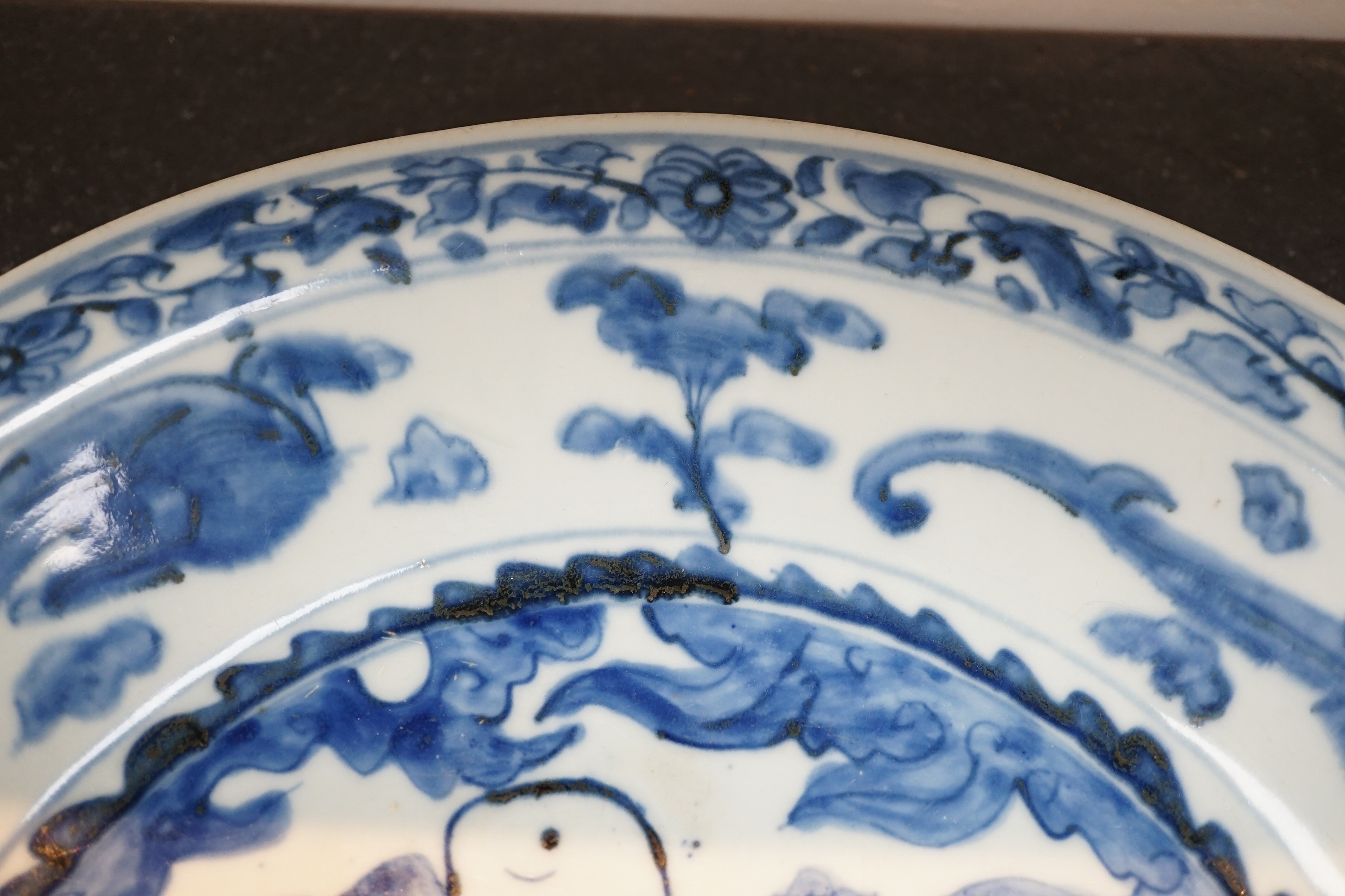 A large Chinese Swatow blue and white ‘Shou Lao’ dish, Zhangzhou kilns, Wanli period, 43.4cm diameter, tiny rim chip